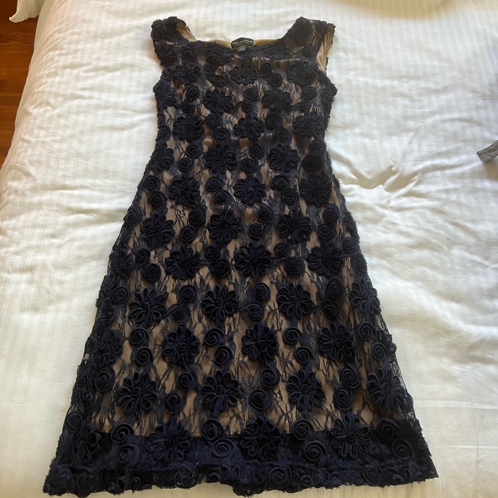 Navy blue lace dress with rosettes.  Size 6.  Connected brand